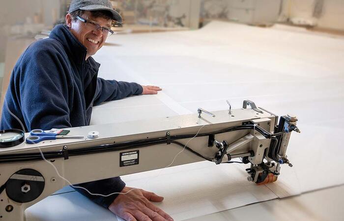 Dave De Jong creating the perfect sail for a grateful sailor in his Thunder Bay loft